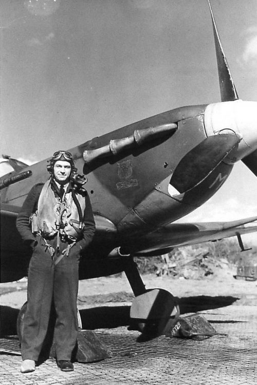 Pilot standing by a Spitfire*
